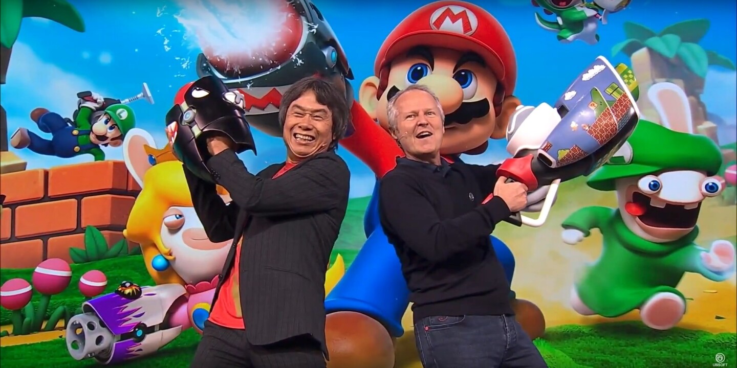 Legendary Mario creator Shigeru Miyamoto (left) and Ubisoft CEO Yves Guillemot (right) reveal Mario + Rabbids Kingdom Battle on stage during Ubisoft's E3 2017 press conference