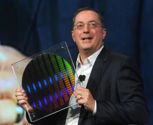 Intel Corp. President and CEO Paul Otellini displays a silicon wafer containing the world's first working chips built on 22nm manufacturing technology.
