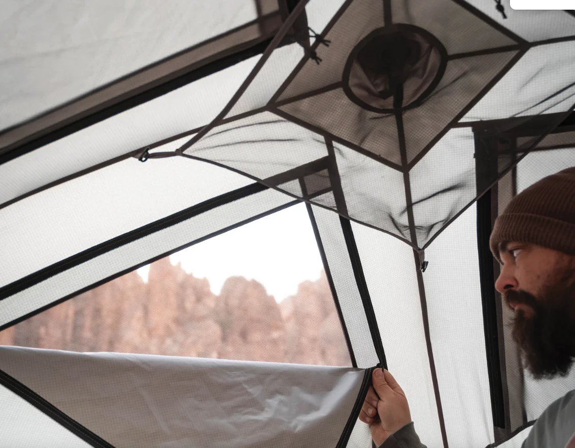 The usual roof mesh gets covered with zippered panels for all-season use