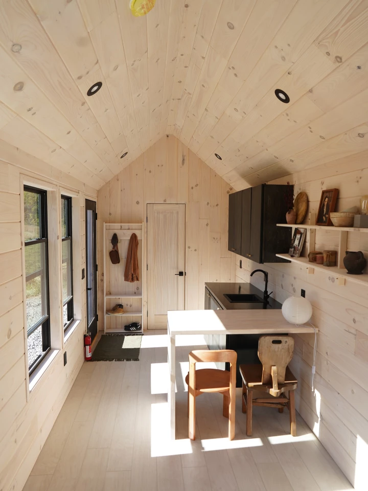 The Homesteader's interior is finished in pine and measures 272 sq ft (25 sq m), which is arranged on one floor
