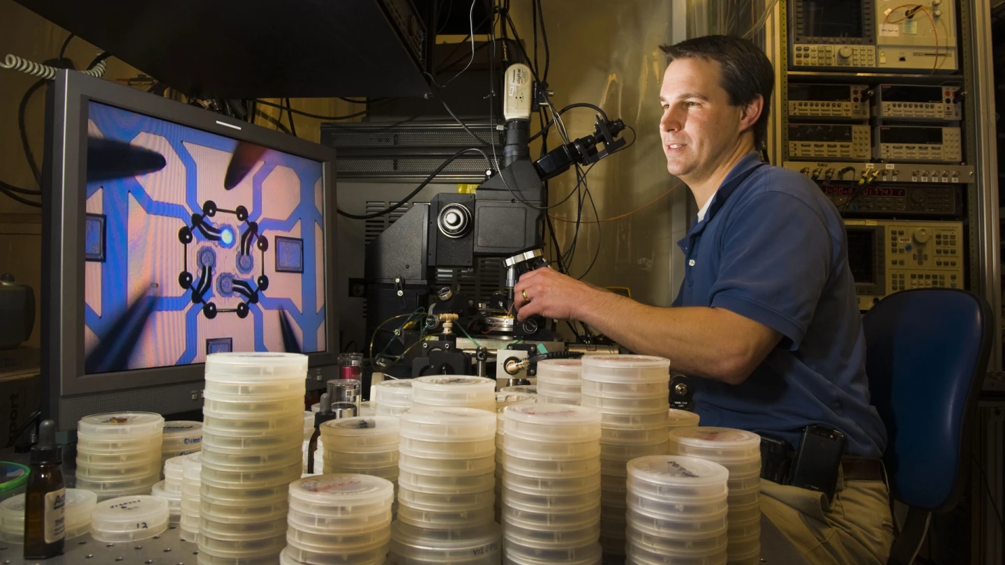 A technician measuring the wavelength of the CSAC's vertical-cavity surface-emitting laser (Photo: Sandia National Laboratories)