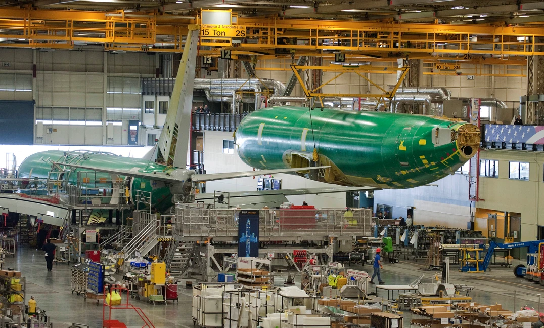The fuselage for the first P-8A Poseidon production aircraft. The sixth test aircraft T6 is in final assembly in the background (Photo: Boeing)