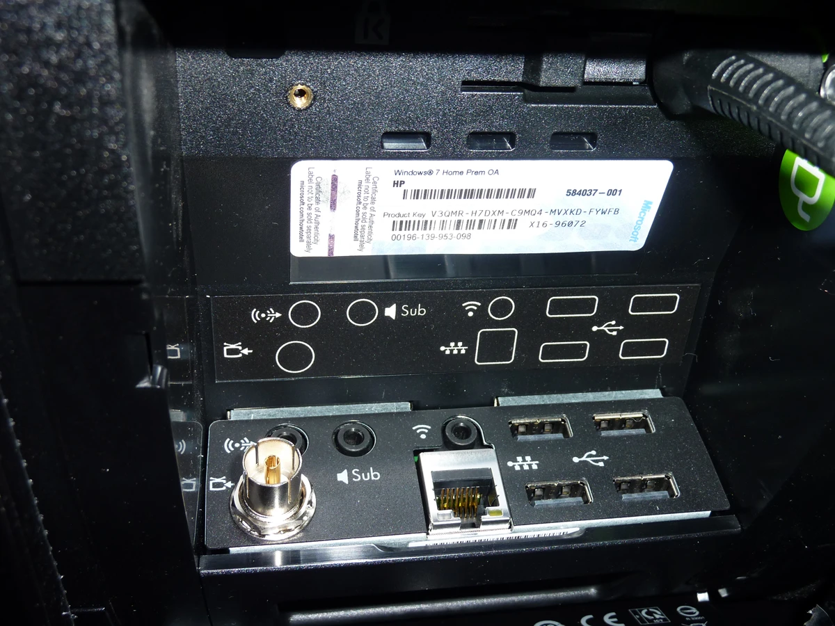 The HP TouchSmart 610-1030a's rear connection compartment