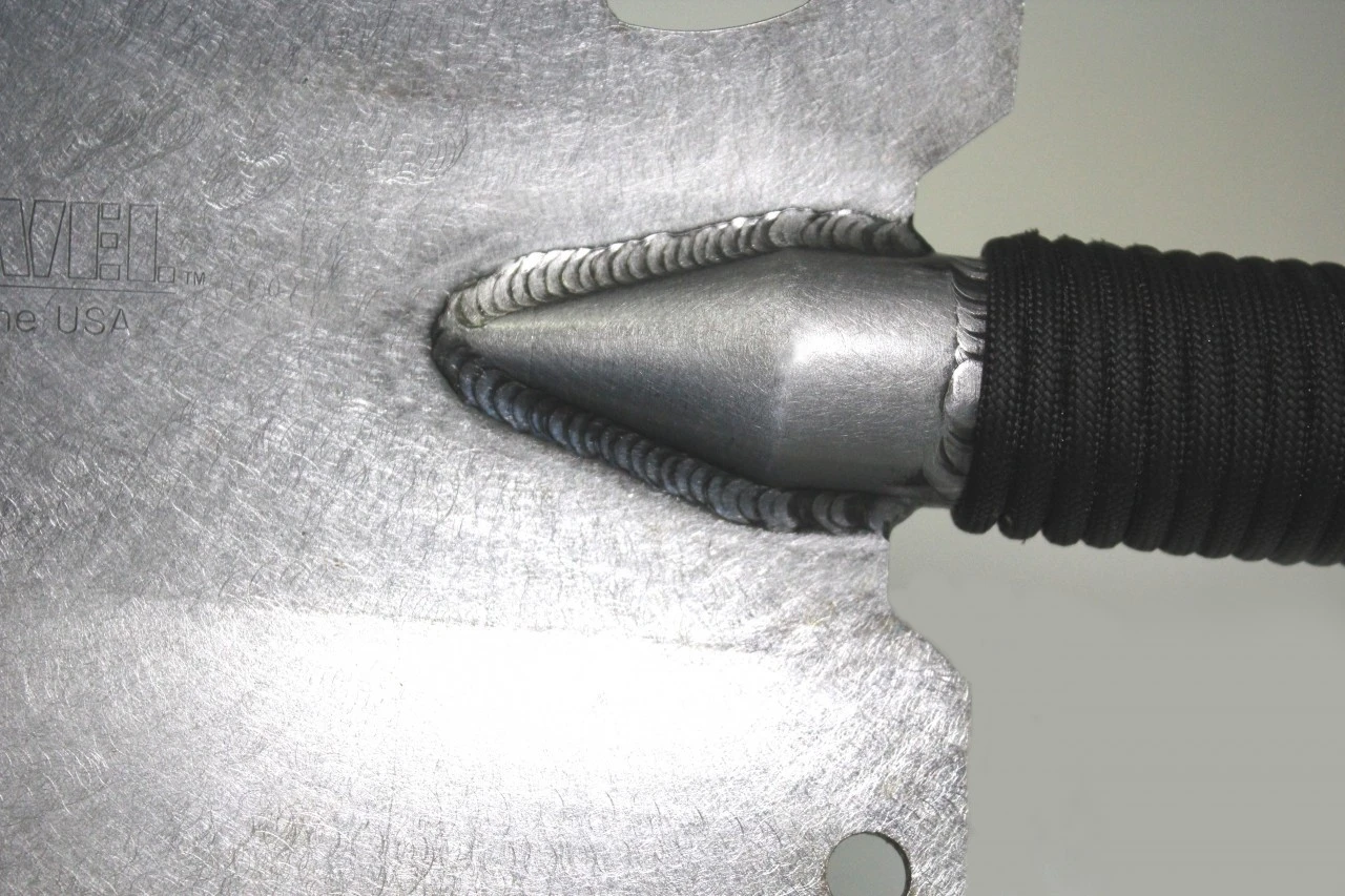 The chromoly steel shovel head features three sharp edges, a serrated saw edge and a bottle opener
