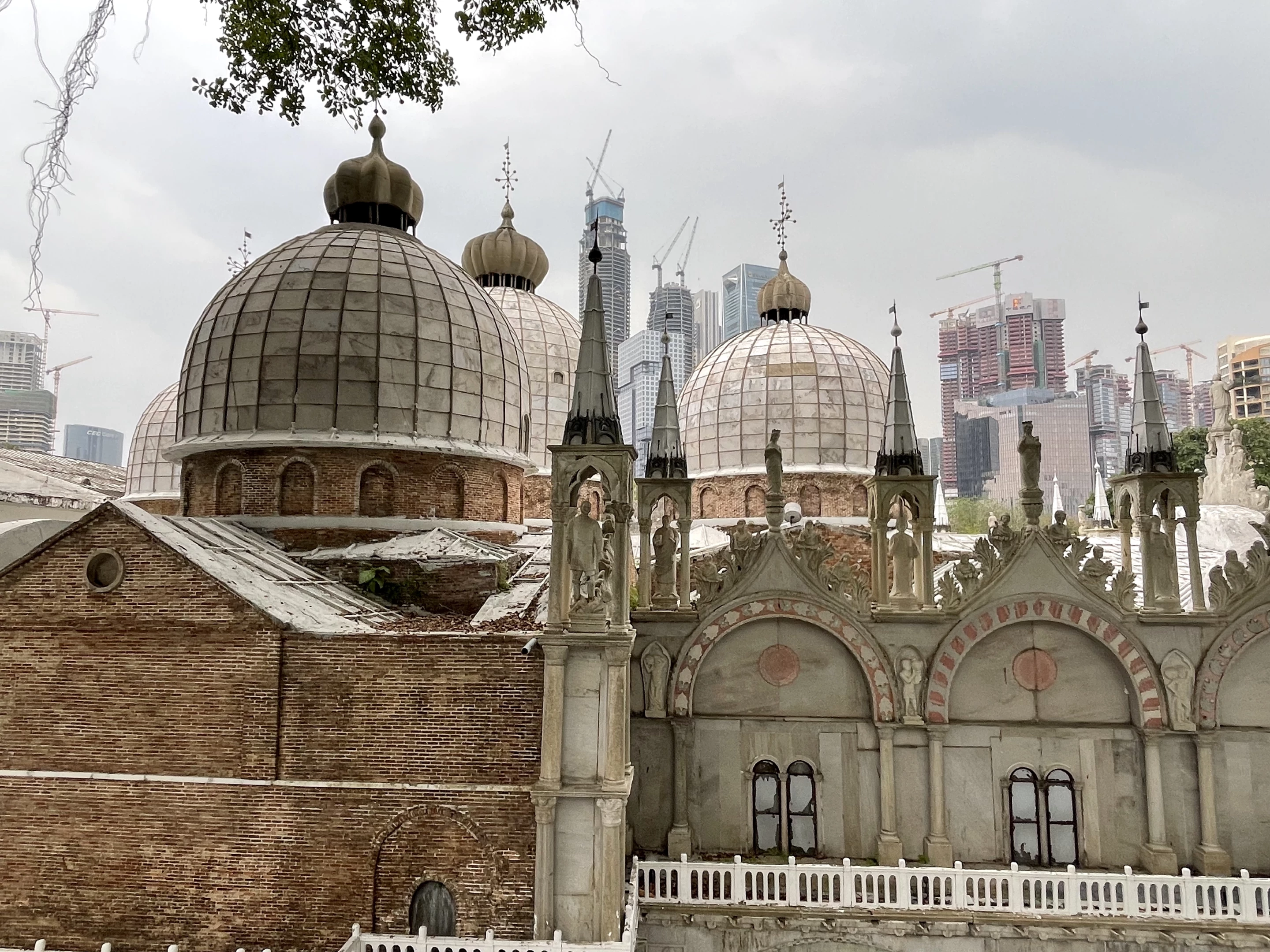 The details of St Mark’s Basilica seemed to merge with the cranes atop new buildings in the background