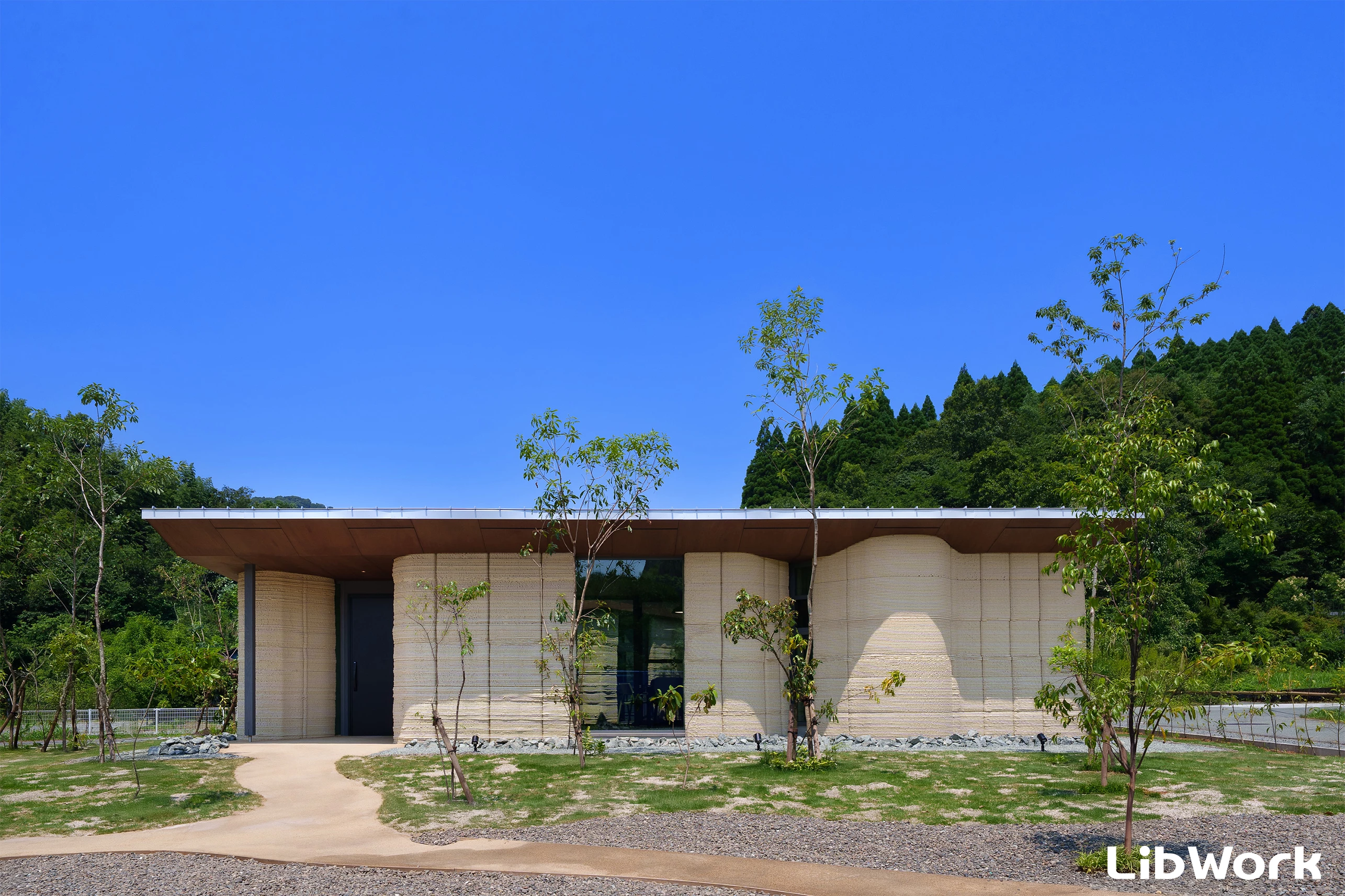 Lib Earth House Model B is a 3D-printed house that's predominantly made from soil, not cement