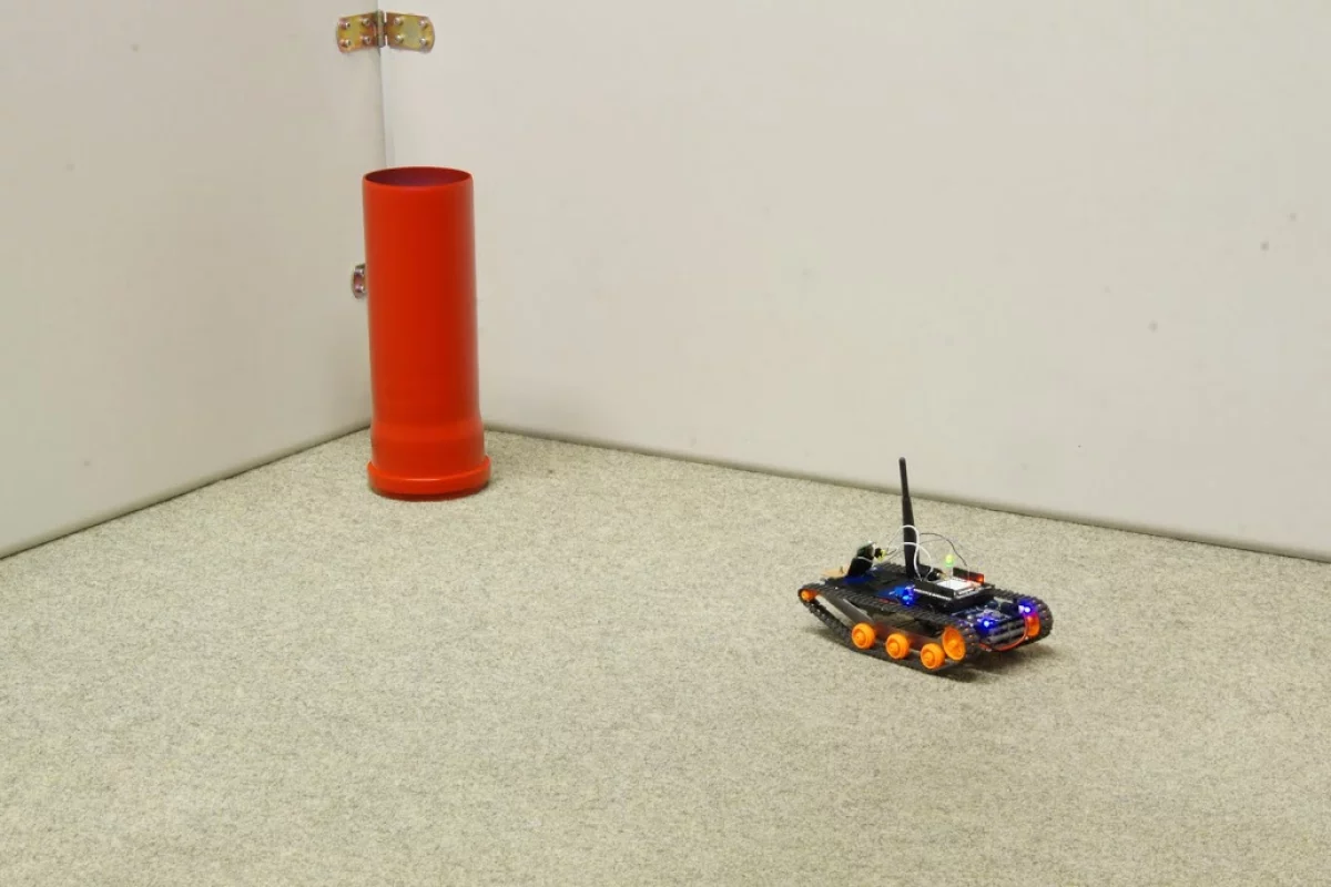 The robot makes a bee-line for a red cylinder, after learning that "red is good"