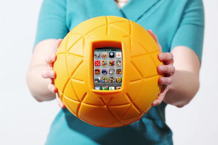 TheO Ball is designed to hold your phone within its cushioned grasp, allowing you to literally throw your phone around to play games without fear of damage