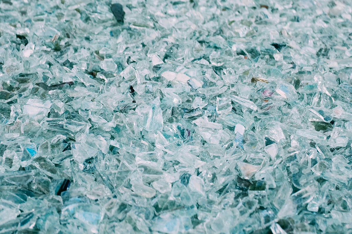 Once processed and powdered, glass can act as a binder for soil and water in compressed earth blocks