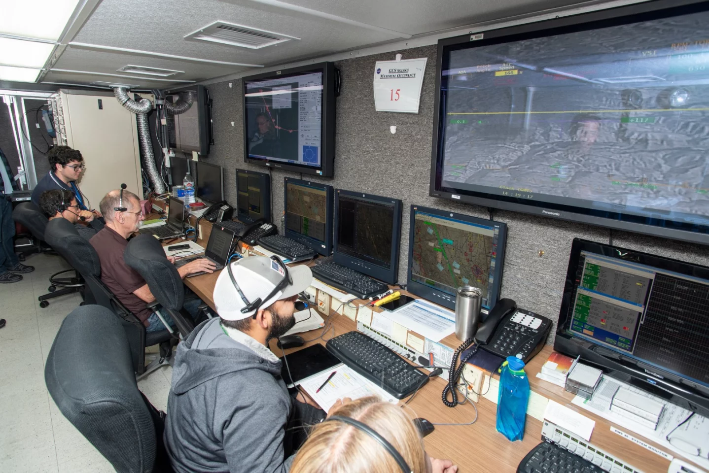 Engineers at NASA‘s Armstrong Flight Research Center monitor the remotely-piloted Ikhana aircraft from a mission control room during a test flight June 12, 2018