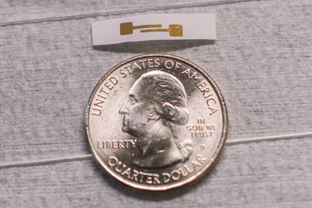 A prototype of the biosensor, with a US quarter for scale
