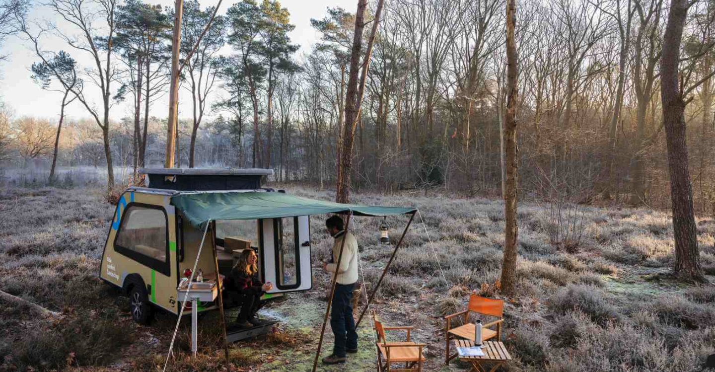 The included awning provides coverage over the outdoor kitchen