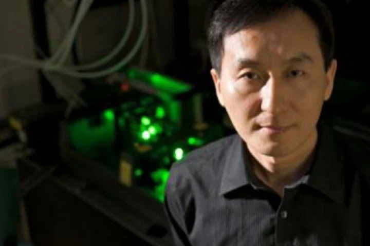 Chunlei Guo and the femtosecond laser usds to create nanostructures in metal that can move liquid uphillPhoto credit: Richard Baker, University of Rochester