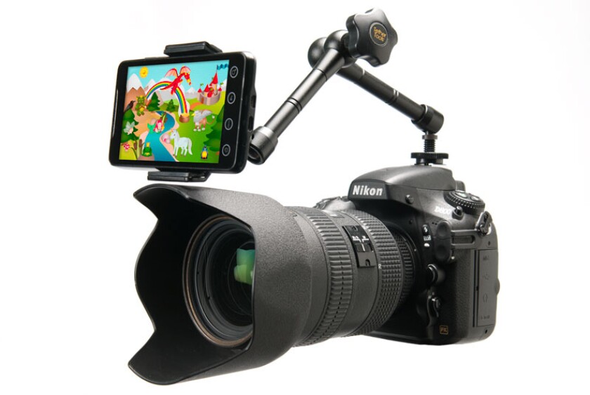 Playing a favorite cartoon or photographs of their friends and family will keep kids looking at the Look Lock ... and therefore the camera