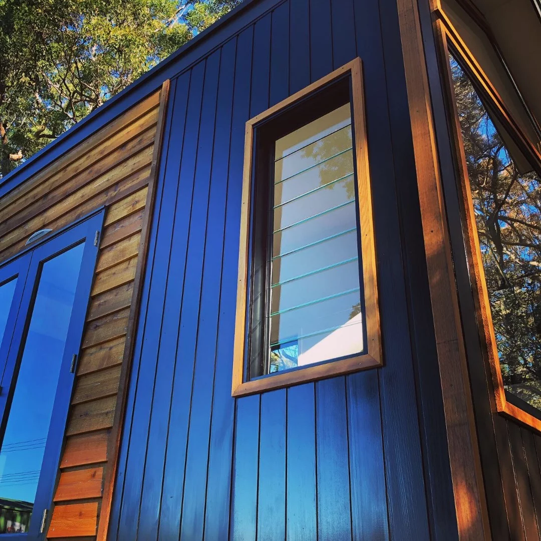 A series of cross flow ventilation windows with louvers provide natural airflow through the home