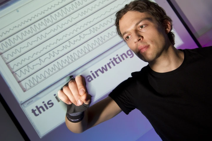 In the airwriting system, a sensor-equipped glove is used to identify letters drawn in the air by the wearer, which are then converted into digital text