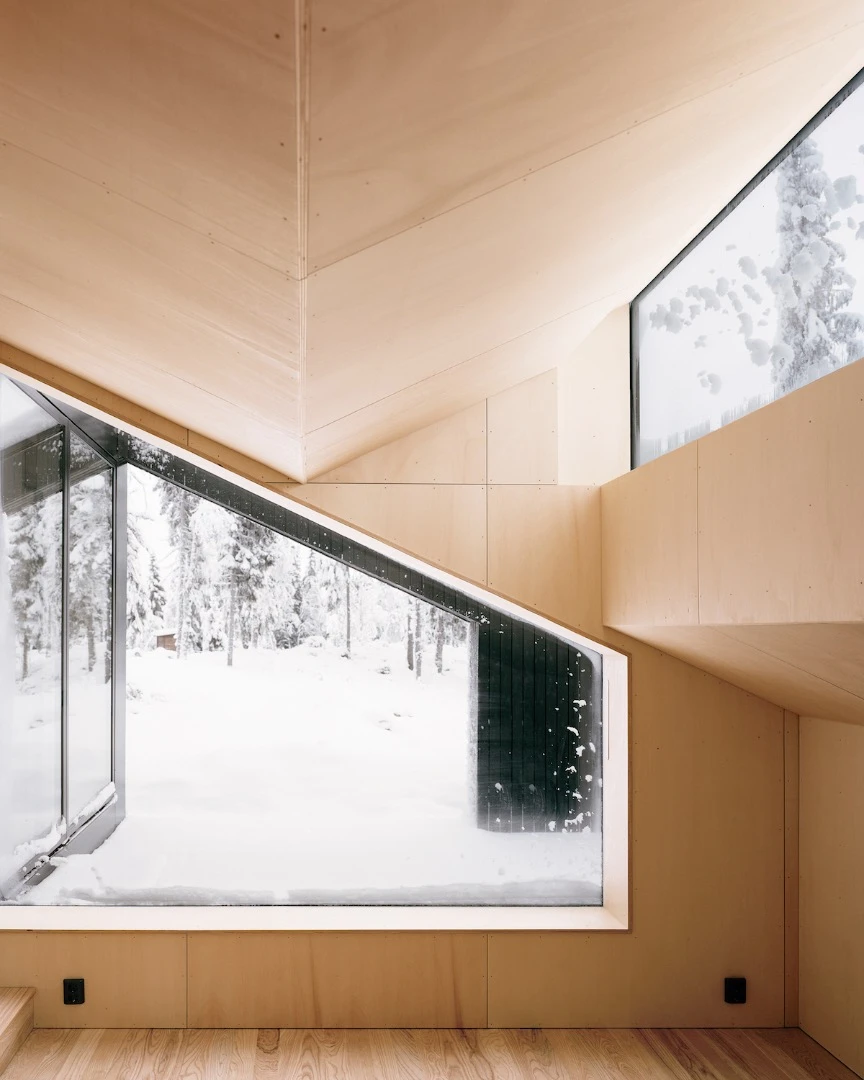 Owing to generous glazing, occupants can lie in the bedroom and gaze at the stars
