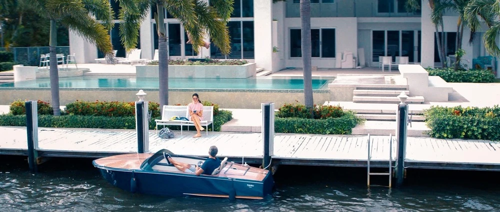 The boats are built with a lightweight molded fiberglass hull with infused real wood