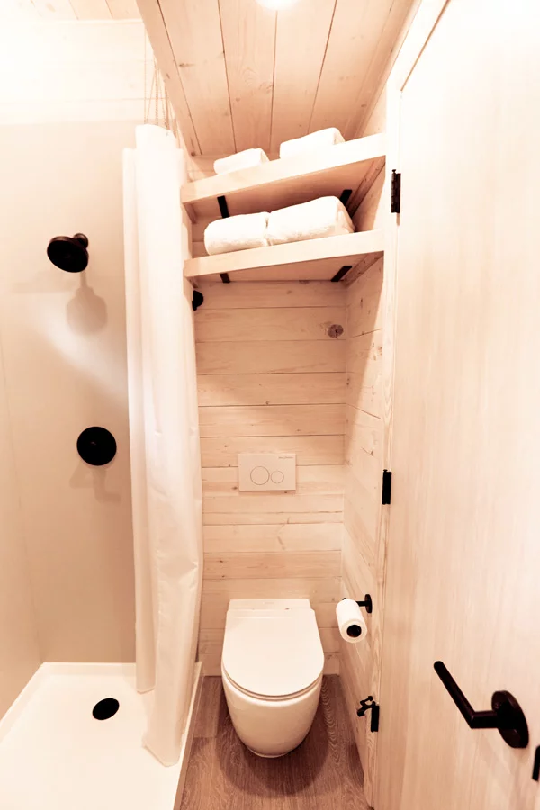 The Draper's bathroom includes a shower, sink, and toilet