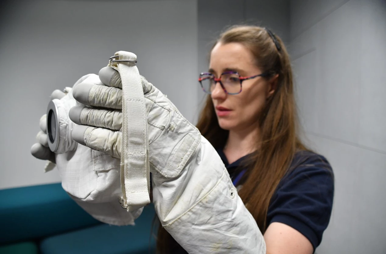 ESA career astronaut Rosemary Coogan holds the Handheld Universal Lunar Camera