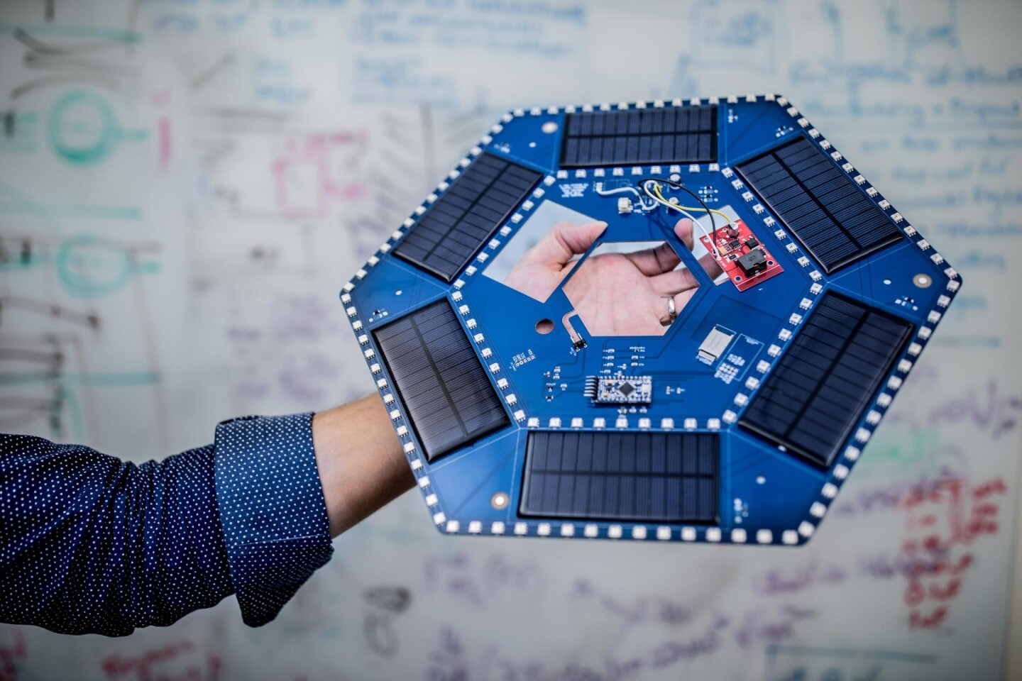 Each tile in NASA's high-tech new path contains circuit boards, six small solar panels, a battery, LEDs, a Bluetooth and a Wi-Fi transmitter, micro controllers and a piezoelectric element