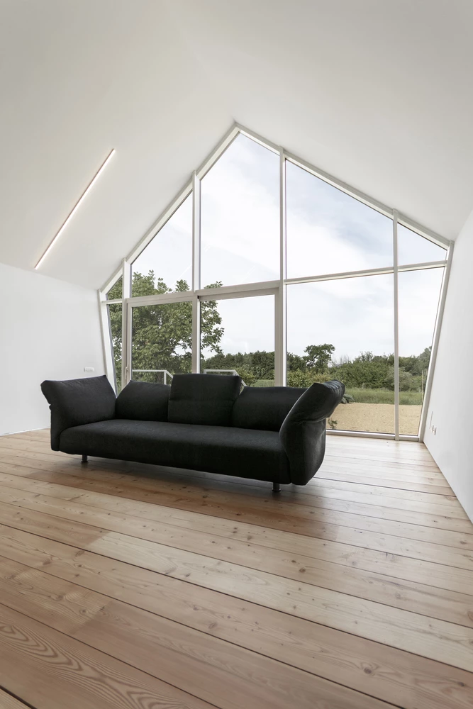 The home features an extra large glass feature wall at the front of the building
