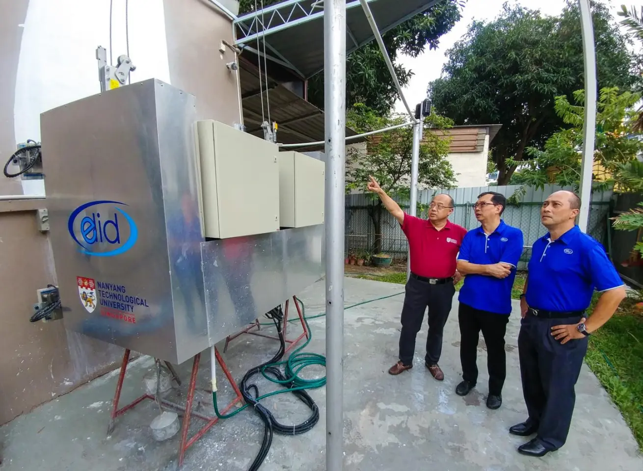 (From left) NTU Professor Chen I-Ming, ELID Group Managing Director Dennis Lim and ELID Vice President Kenneth Wong at the launch of the OutoBot in Singapore