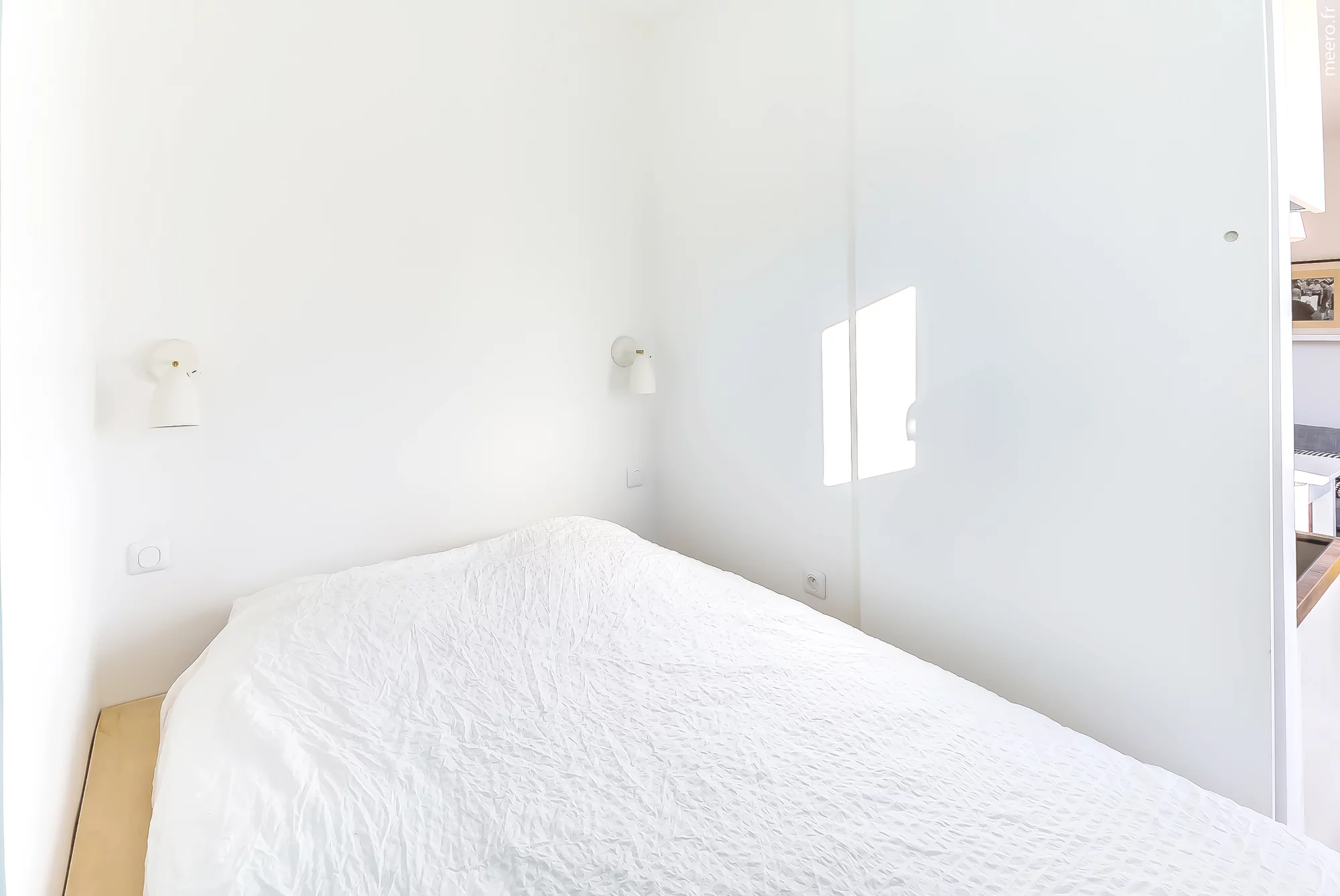 The bedroom area is quite novel and includes a bed that can be raised, Murphy bed style, to reveal a large storage space (Photo: Meero)