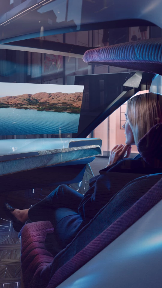 The large head-up display on the Interaction Ease's windshield has three modes: Explore mode delivers augmented reality information about the surroundings; Entertain mode offers digital entertainment; and Ease mode darkens the cabin for relaxation
