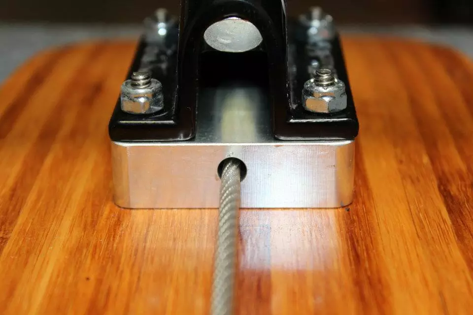 Crank the cable to make the board stiffer or more flexible