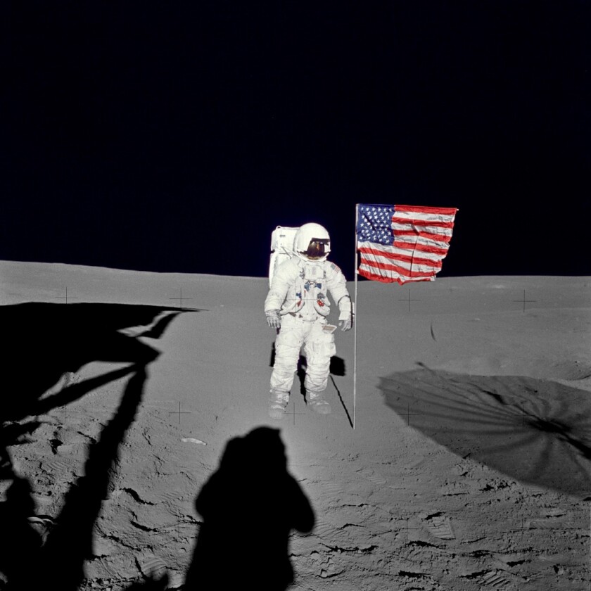 Ed Mitchell with the American flag on the Moon