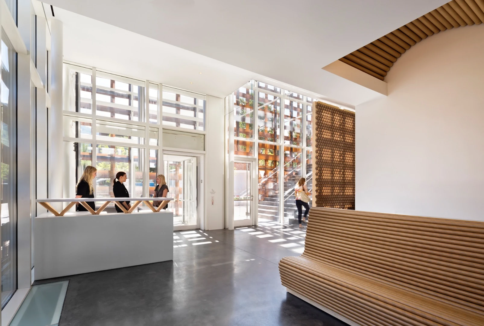 The Aspen Art Museum is wrapped in a woven composite wood screen with a long-span timber roof