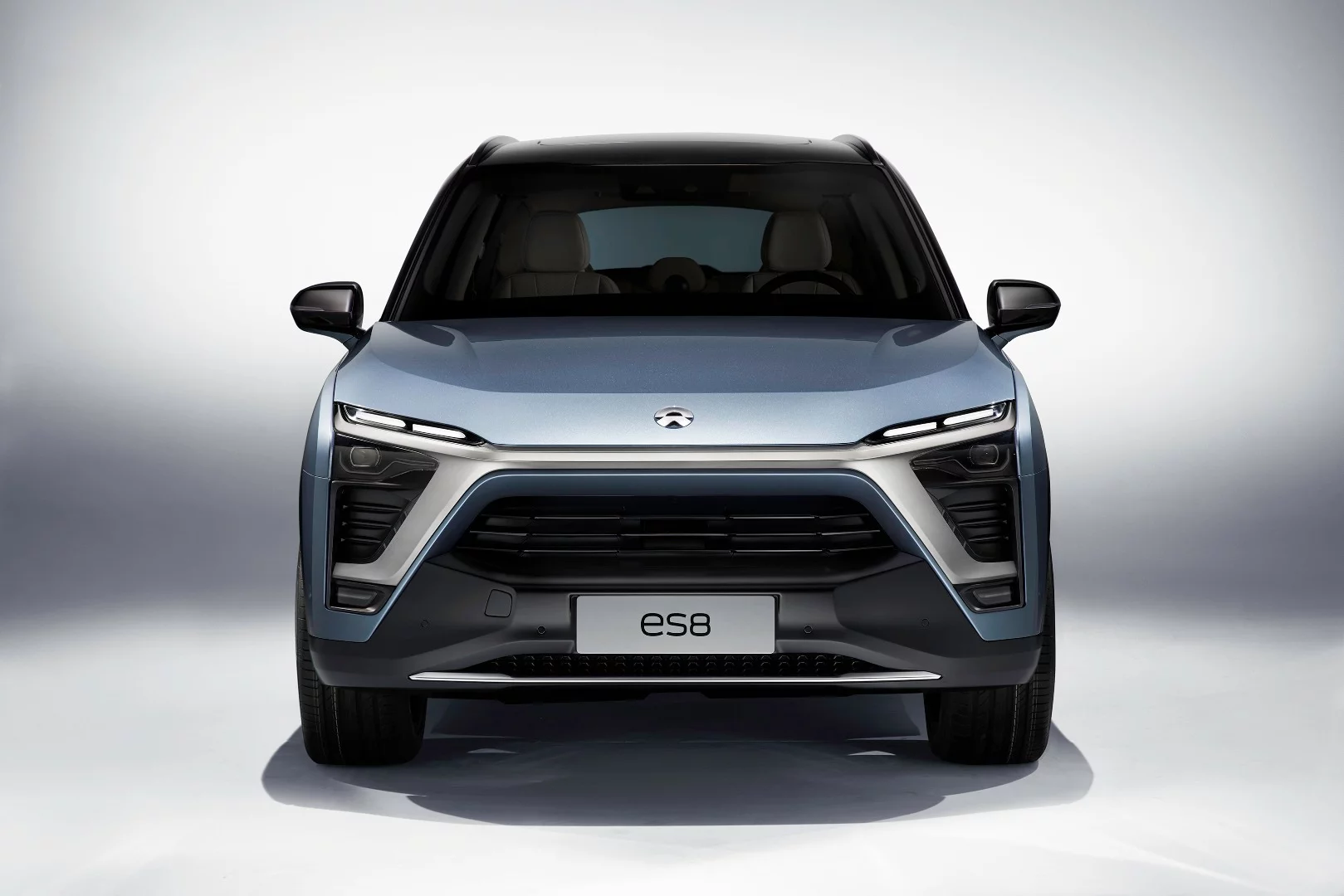 The front of the ES8 carries NIO's corporate style branding with the cross-grille design