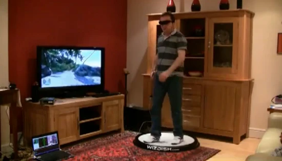 WizDish in action: in front of a television set accommodating a gamer wearing a VR headset