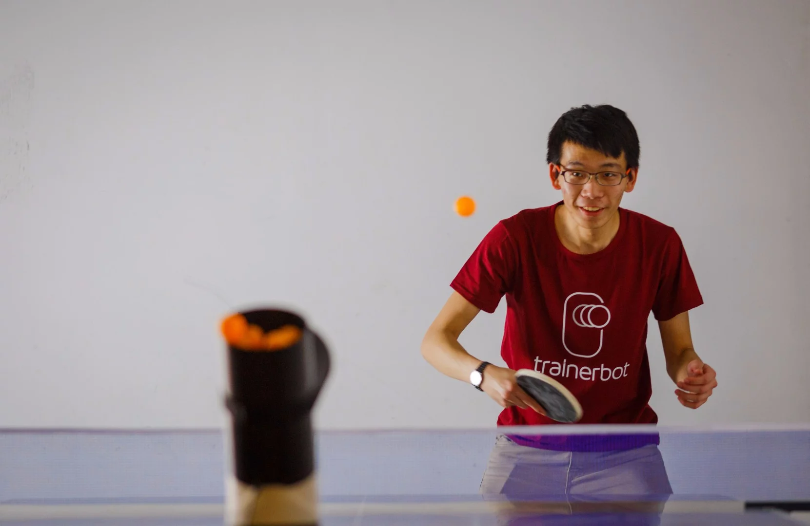 Trainerbot features a top-loading hopper that can hold up to 30 ping-pong balls at one time