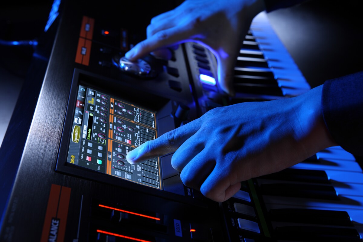 An LCD touchscreen interface is used in conjunction with the numerous control dials, knobs and buttons, the mixer sliders to control the instrument's sonic output