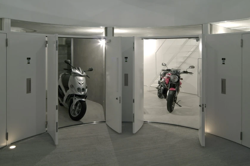 Theses garages also serve as the entrances to each apartment, with stairs up to the living quarters above