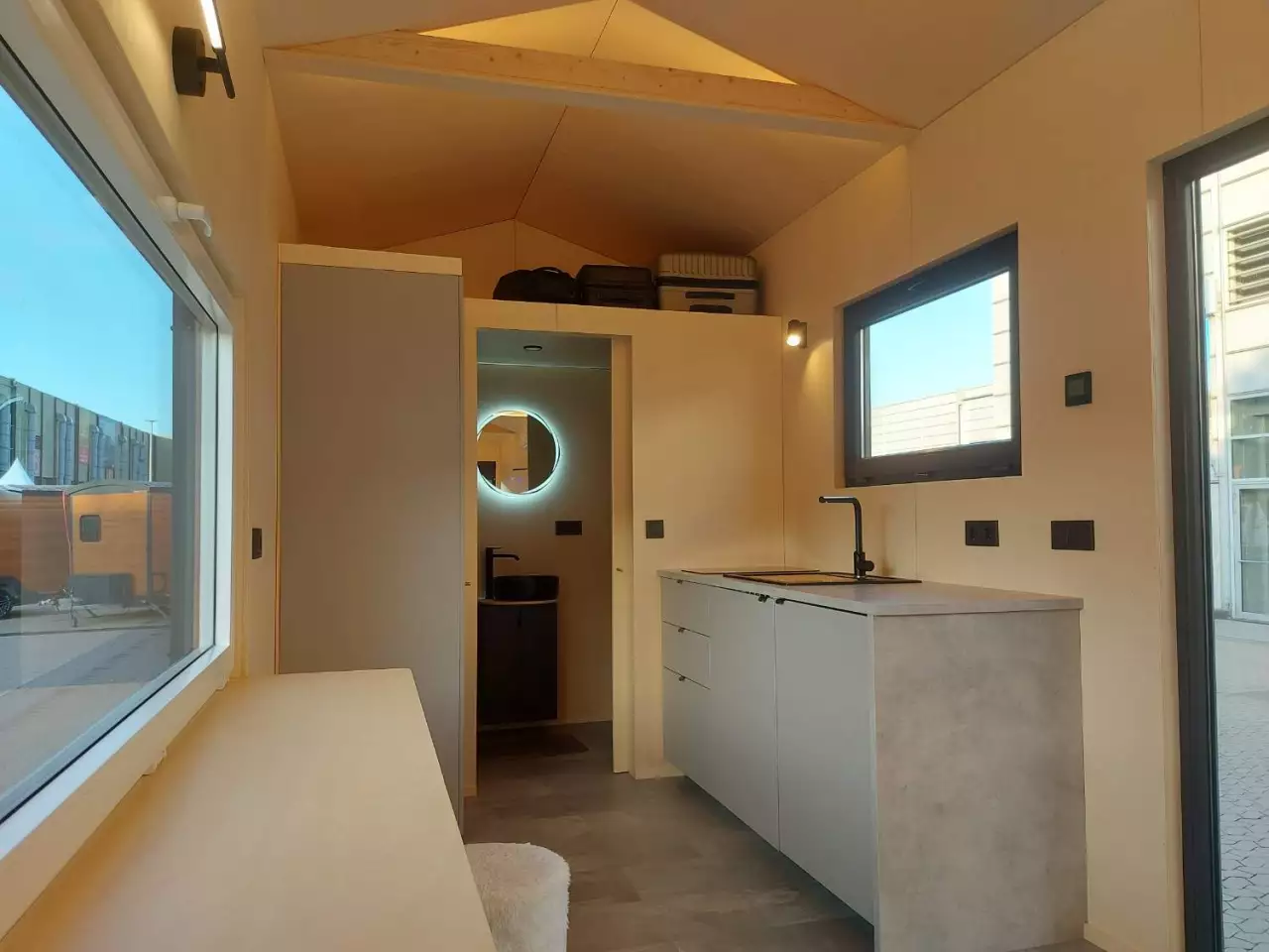 The BTH Single's kitchen includes a sink, an induction cooktop, and quite a lot of cabinetry