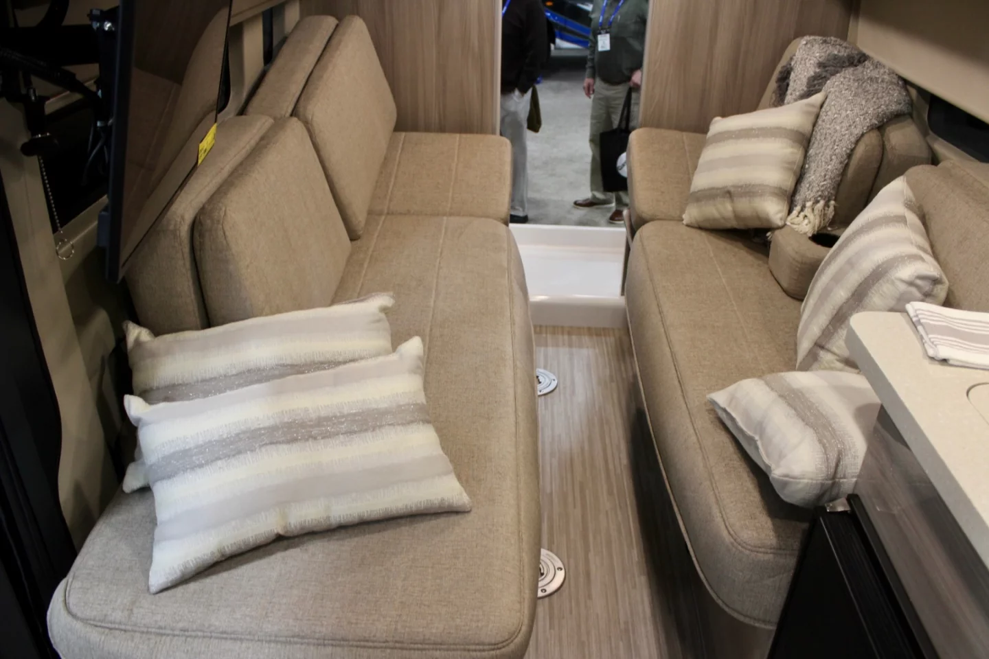 The versatile living area includes two sofa-beds that convert into a larger bed and two removable dining tables