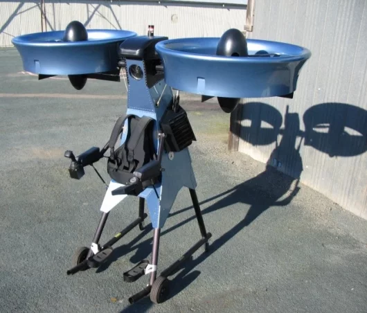 The Springtail Exoskeleton Flying Vehicle is powered by a single 118 hp rotary engine, which drives two counter-rotating fans housed in one meter diameter ducts on each side of the aircraft above the pilot