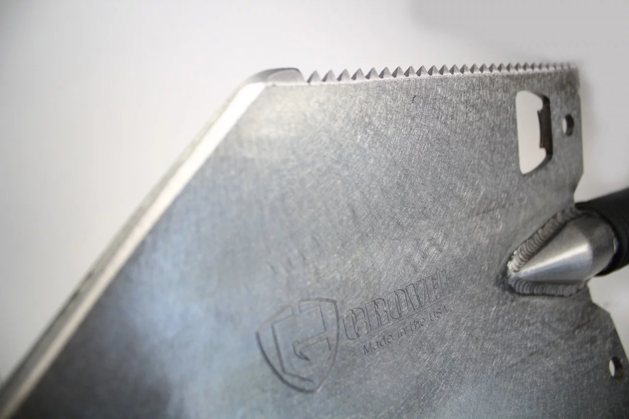 The chromoly steel shovel head features three sharp edges, a serrated saw edge and a bottle opener