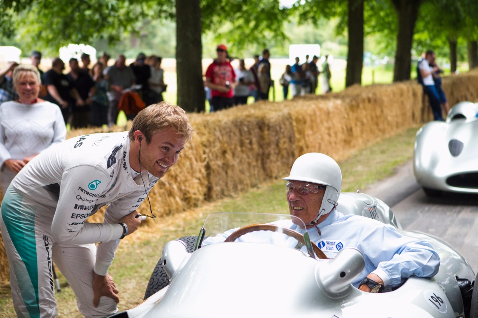 Nico Rosberg and Sir Sterling Moss. Nico has driven for Mercedes-Benz since 2010. Moss last drove for the marque in 1955. Nico is 30 years-of-age. Moss is 85, raced from 1948 to 1962, won 212 of the 529 races he entered, and drove 84 different makes of car