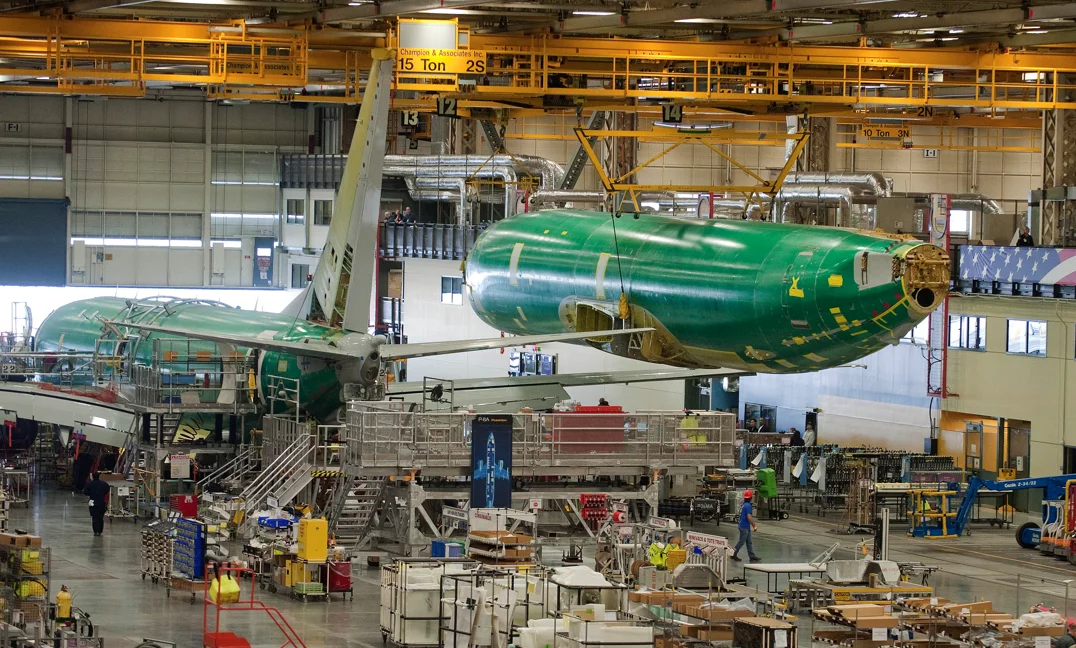 The fuselage for the first P-8A Poseidon production aircraft. The sixth test aircraft T6 is in final assembly in the background (Photo: Boeing)