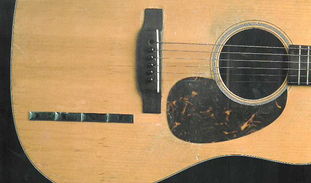 Elvis added stick-on metal lettering to this guitar, spelling out "ELVIS." Only the first four letters of the name remain.