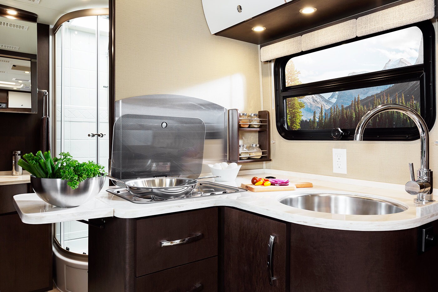 Unity motorhome combines Murphy bed and swivel recliners in comfy