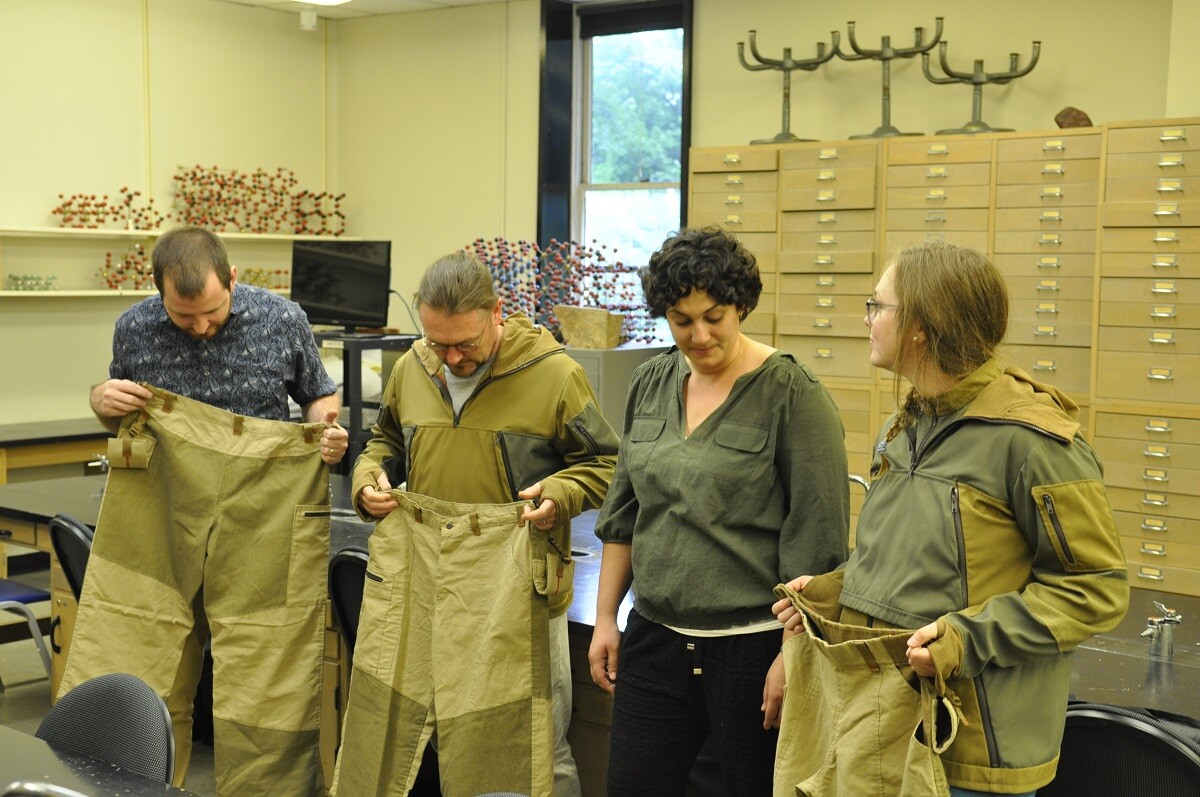 Abby Romine, pictured here with Stuart Kenderes, far left, Alan Whittington, second from left, and Emily Cunningham, far right, created prototype lava suits for Alan Whittington and his team of graduate students for their work as volcanologists