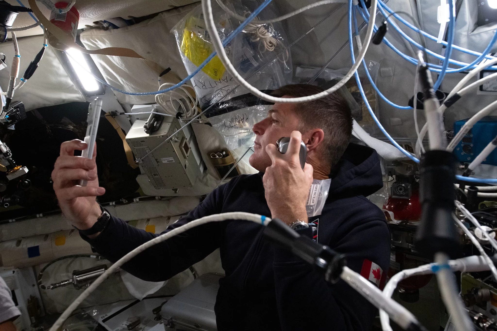 Jeremy Hansen enjoys a shave inside the Orion spacecraft