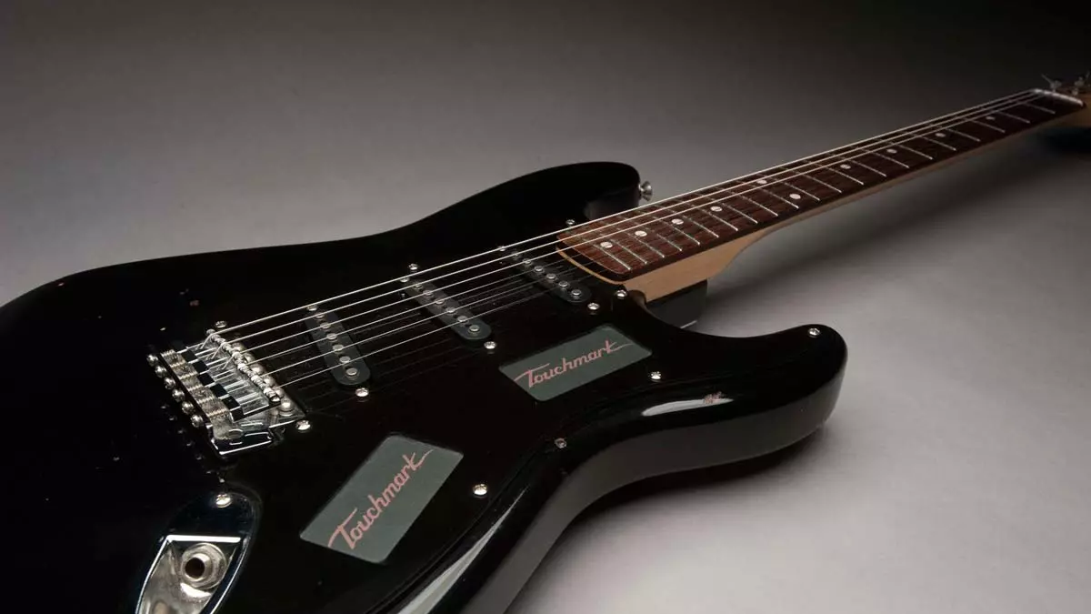 The Touchmark Interface System replaces the volume/tone knobs and pickup selector switch on an electric guitar with touch control panels