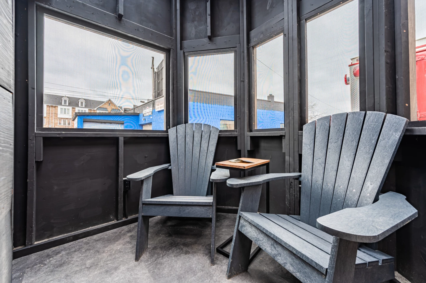 The Sherloak Homes' bookshelf door offers access to an enclosed porch-style area