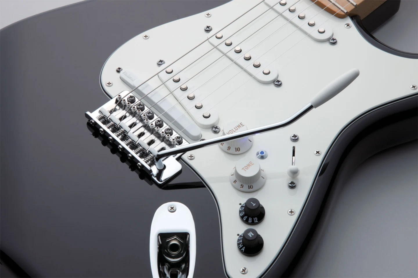 For all the digital sound manipulation magic to happen, there's a Roland GK-3 Divided Pickup mounted between the bridge and a "normal" pickup which sends the captured signal from each string to the COSM engine for digital processing